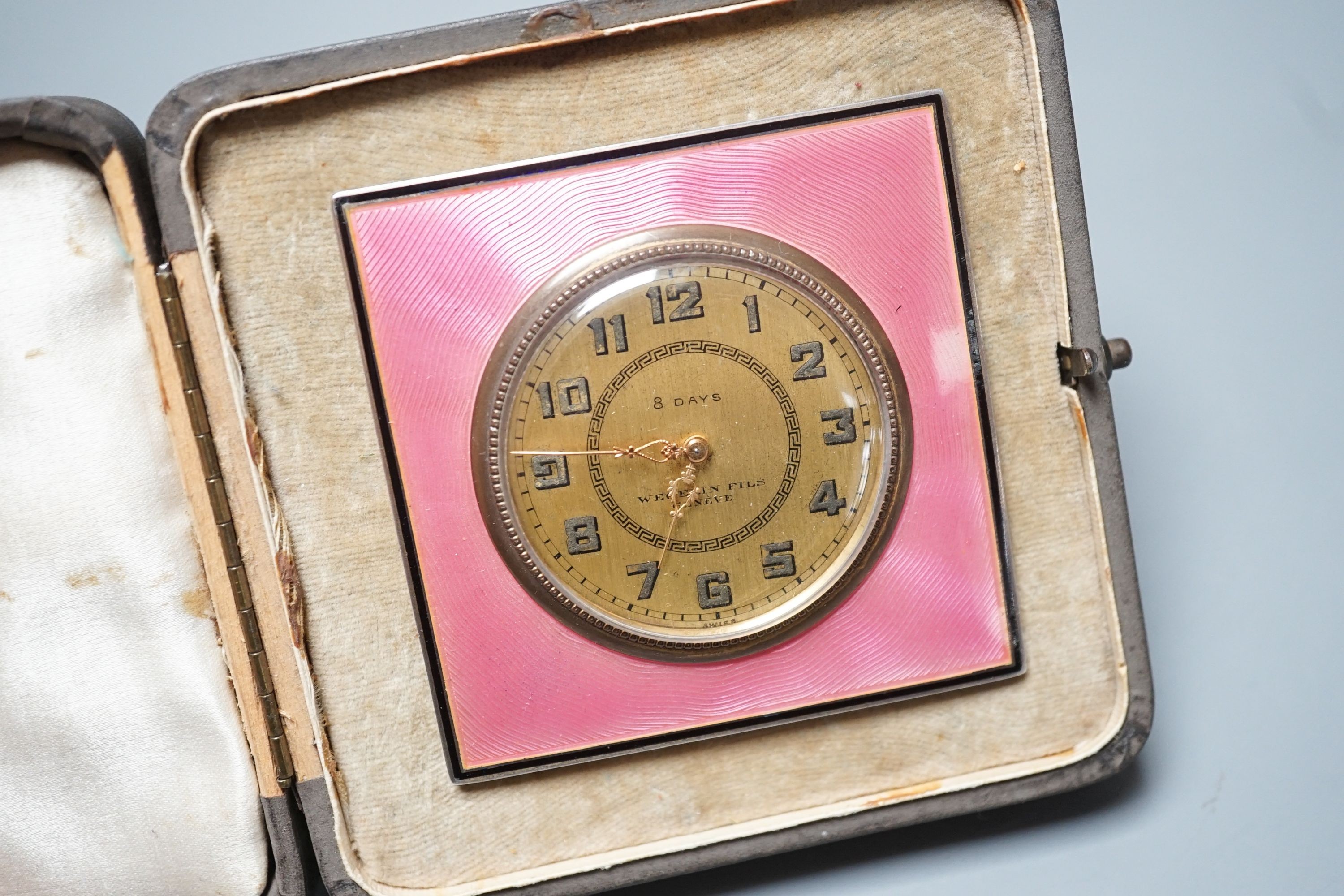 A Swiss 935 white metal and pink guilloche enamel easel timepiece, in original fitted case, 65mm.